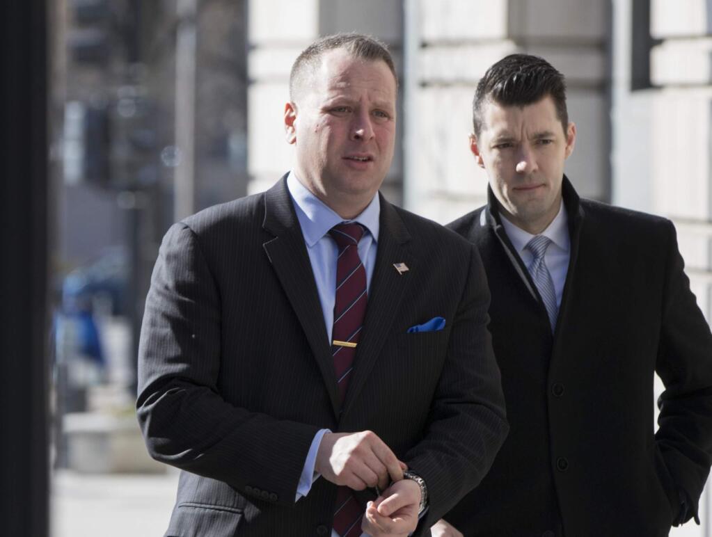 Former Trump campaign aide Sam Nunberg, left, arrives at the U.S. District Courthouse to appear before a grand jury, Friday, March 9, 2018 in Washington. Nunberg had insisted in a series of defiant interviews earlier in the week that he intended to defy a subpoena issued by special counsel Robert Mueller's office, which is investigating potential coordination between Russia and the Trump campaign. (AP Photo/J. Scott Applewhite)