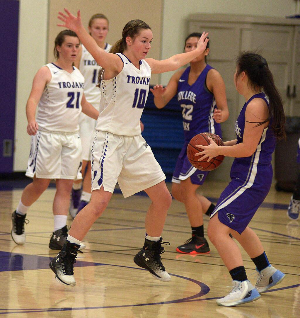 SUMNER FOWLER/FOR THE ARGUS-COURIERPetaluma's Kalleigh Pate leaves College Park's Evelyn Kim with no where to go during Petaluma's 57-43 victory.