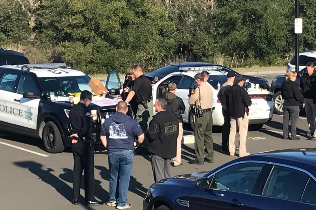 Authorities at the command post set up on San Marin Drive in Novato in the search for suspects in multiple Petaluma home invasions on Monday, March 12, 2018. (BETH SCHLANKER/ PD)
