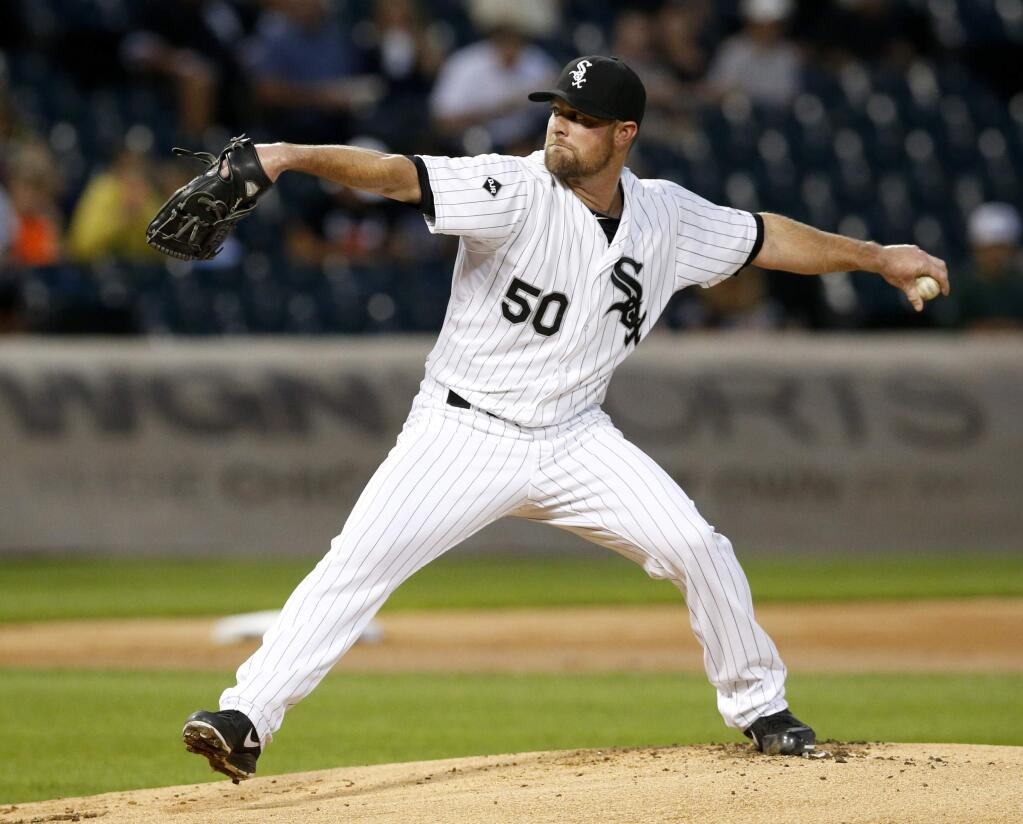 Chicago White Sox starting pitcher John Danks delivers during the first inning of a baseball game against the Oakland Athletics on Tuesday, Sept. 9, 2014, in Chicago. (AP Photo/Charles Rex Arbogast)