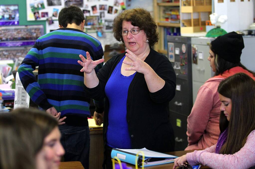 Petaluma High School English teacher Krista O'Connor works with students on an assignment about race and the book 'To Kill a Mockingbird.' (photo by John Burgess/The Press Democrat)