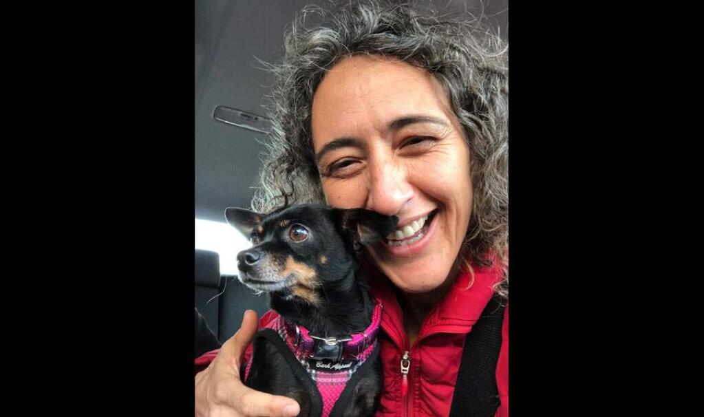 Silvia Barrera was reunited Friday with her lost Chihuahua, Yuki, missing for two weeks, with the help of a private investigator.