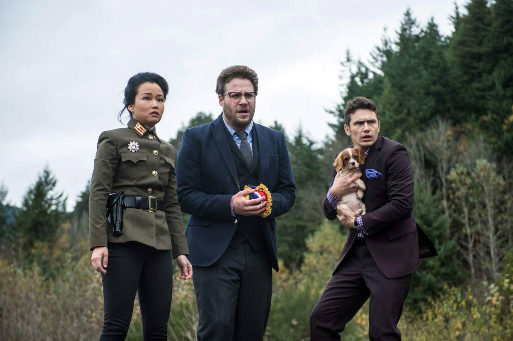 This photo provided by Columbia Pictures - Sony shows, from left, Diana Bang, as Sook, Seth Rogen, as Aaron, and James Franco, as Dave, in Columbia Pictures' 'The Interview.' (AP Photo/Columbia Pictures - Sony, Ed Araquel)
