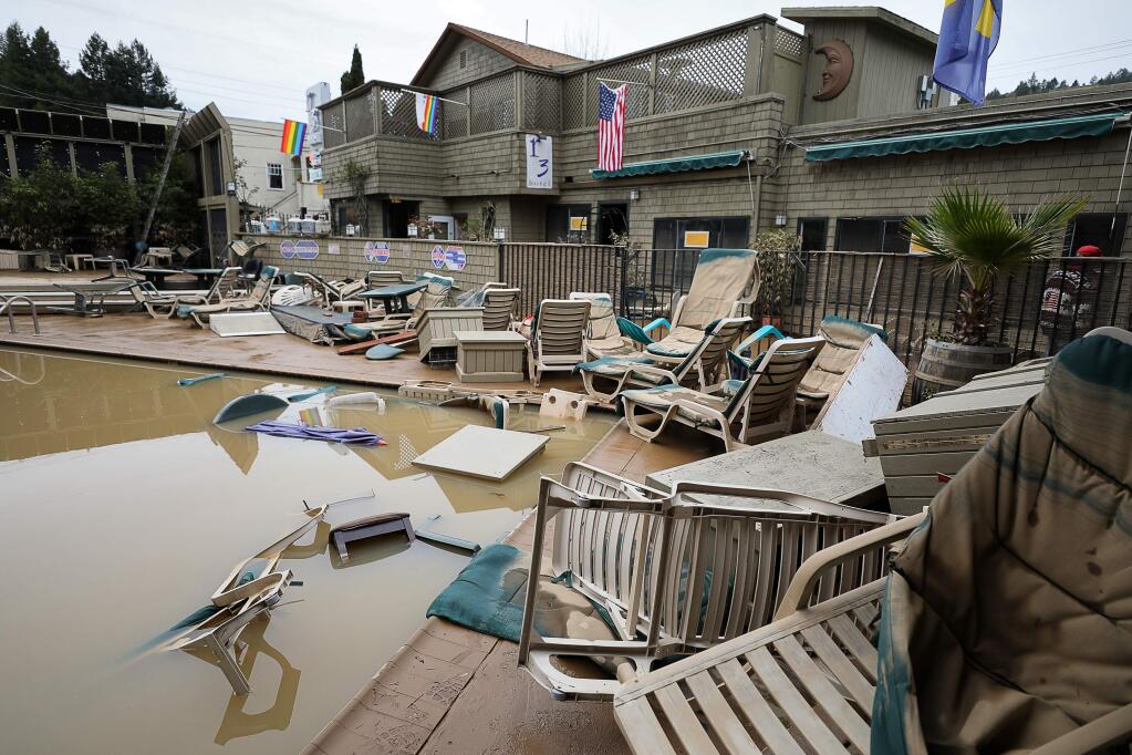 The R3 Hotel is covered in a layer of mud after floodwaters receded from the property in Guerneville on Friday, March 1, 2019. (Christopher Chung/ The Press Democrat)