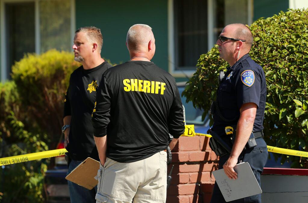 Sonoma County sheriff's personnel investigate the scene of a fatal shooting by a Santa Rosa police officer at a home on West Steele Lane in Santa Rosa on Saturday, Aug. 5, 2017. (JOHN BURGESS/ PD)