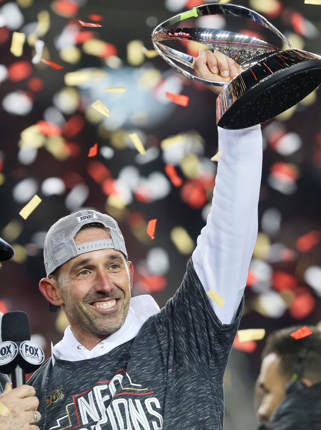 San Francisco 49ers head coach Kyle Shanahan lifts the George Halas Trophy after winning NFC Championship game against the Green Bay Packers at Levi's Stadium in Santa Clara on Sunday, January 19, 2020. The 49ers defeated the Packers 37-20.(Christopher Chung/ The Press Democrat)