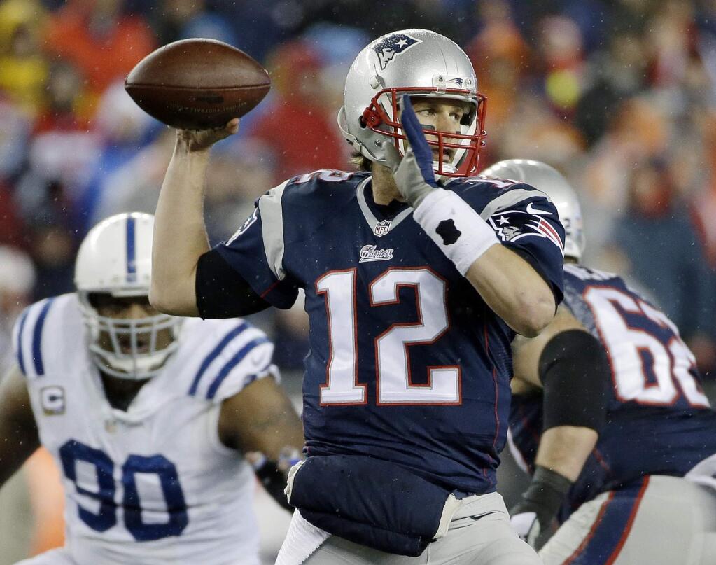 FILE - In this Jan. 18, 2015, file photo, New England Patriots quarterback Tom Brady looks to pass during the first half of the NFL football AFC Championship game against the Indianapolis Colts in Foxborough, Mass. (AP Photo/Matt Slocum, File)