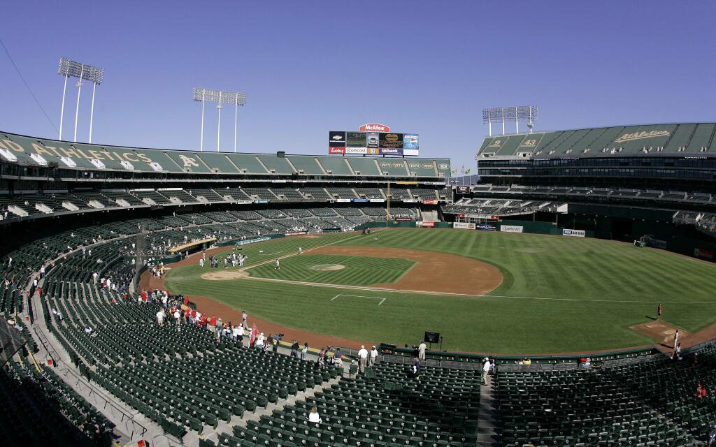 This Sept. 30, 2007 file photo shows O.Co Coliseum, then called McAfee Coliseum, home of the Oakland Athletics baseball team, in Oakland. (AP Photo/Eric Risberg, File)