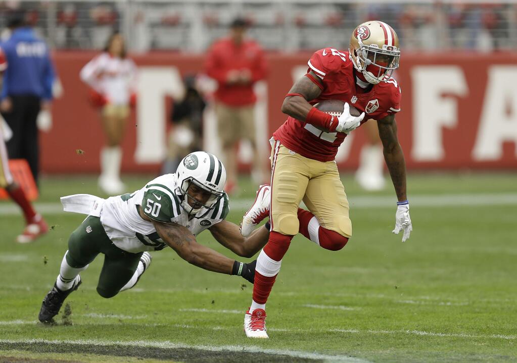 San Francisco 49ers wide receiver Quinton Patton (11) runs from New York Jets outside linebacker Darron Lee (50) during the first half of an NFL football game in Santa Clara, Calif., Sunday, Dec. 11, 2016. (AP Photo/Ben Margot)