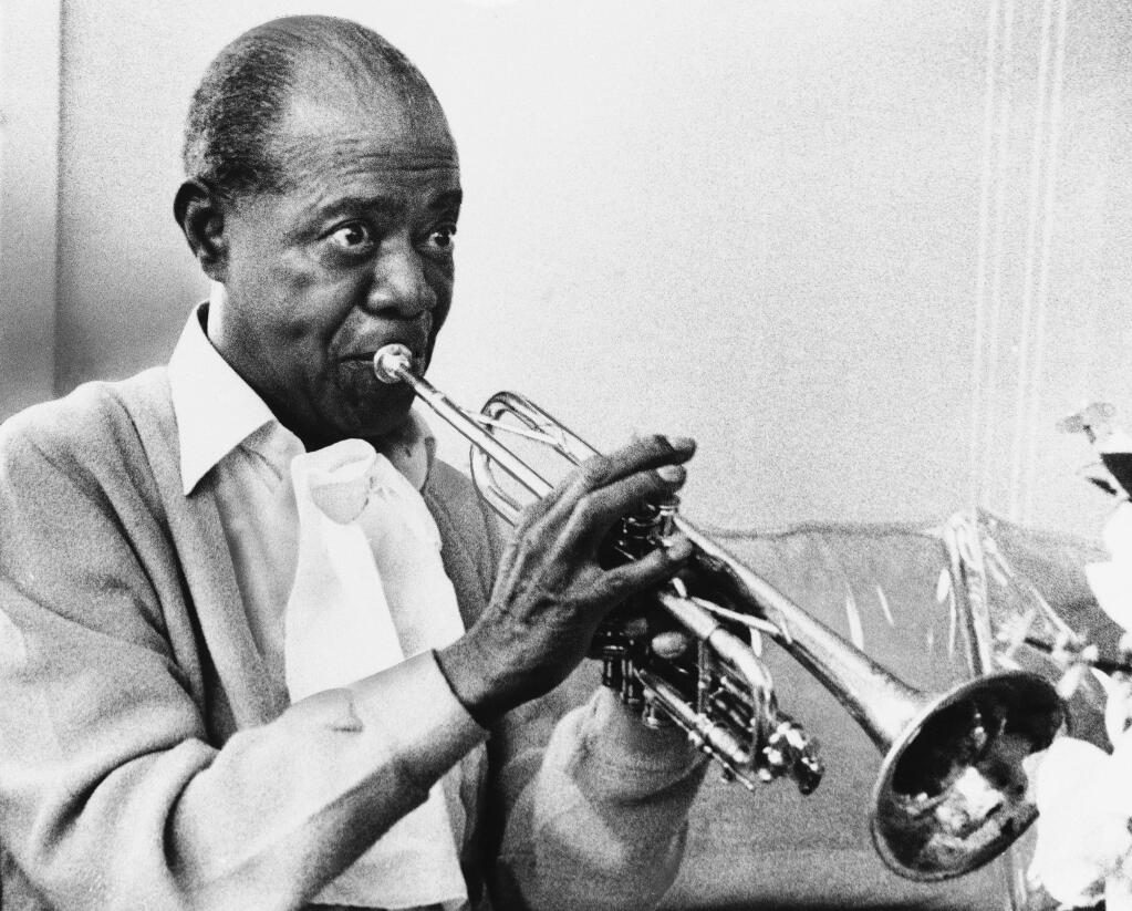 FILE - In a June 21, 1971 file photo, Louis Armstrong practices with his horn at his Corona, New York home. Trumpeter and singer Byron Stripling will perform some songs Louis Armstrong made famous at the Santa Rosa Symphony Pops' tribute this Saturday. (AP Photo/Eddie Adams, File)