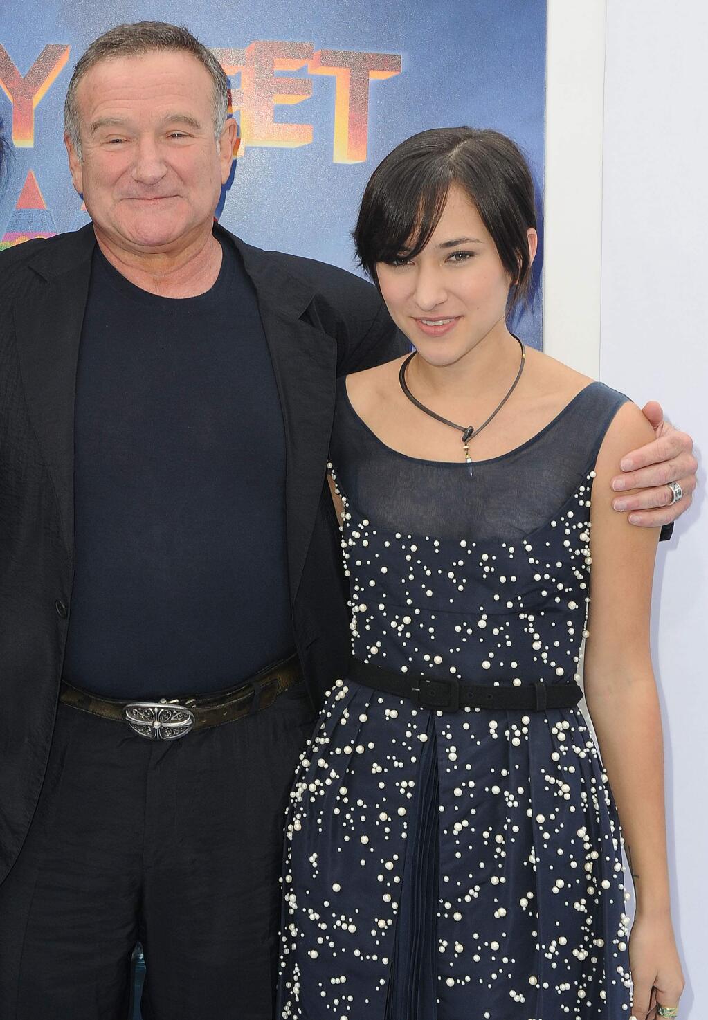 This Nov. 13, 2011 file photo shows actor Robin Williams, left, and his daughter, Zelda at the premiere of 'Happy Feet Two' in Los Angeles. (AP Photo/Katy Winn, File)