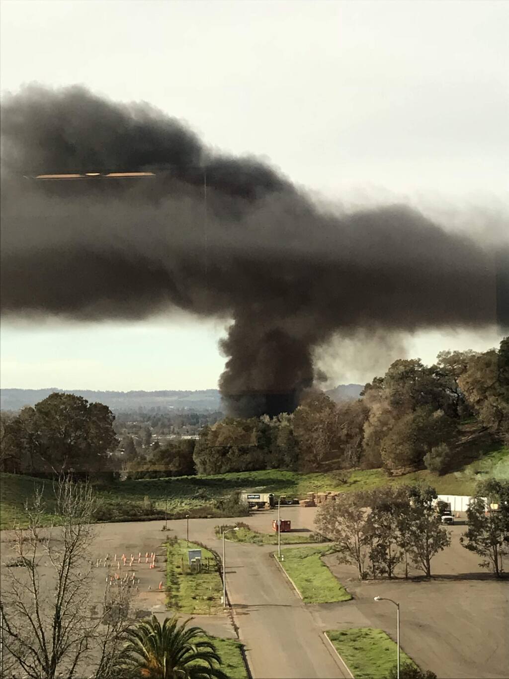 A large truck driving on Fountaingrove Parkway slammed into multiple vehicles, catching fire and sending a huge plume of dark smoke over the northern end of Santa Rosa on Monday, Feb. 5, 2018. (COURTESY OF TINA MONTGOMERY)