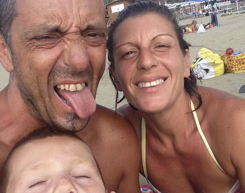 Undated Facebook photo of Roberto Robbiano, 43, top left, Ersilia Piccinino, 41, right, and their nine-year old son Samuel, who were among the victims of the Morandi highway bridge that collapsed in Genoa, northern Italy, Tuesday, Aug. 14, 2018. A bridge on a main highway linking Italy with France collapsed in the Italian port city of Genoa during a sudden, violent storm, sending vehicles plunging 90 meters (nearly 300 feet) into a heap of rubble below and killing 39 people. (Roberto Robbiano via AP)