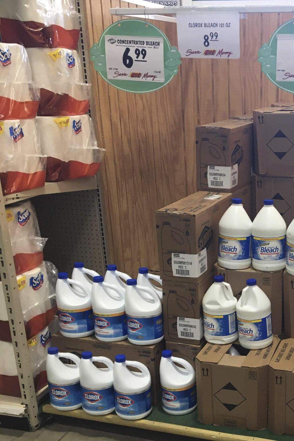 This March 10, 2020 photo made by an investigator with the Michigan Attorney General's Office shows gallons of Clorox bleach on display priced at $8.99 each at a Menards store in Jackson, Mich. A price sticker on an empty shelf elsewhere in the store listed it as $4.47. (Michigan Attorney General's Office via AP)