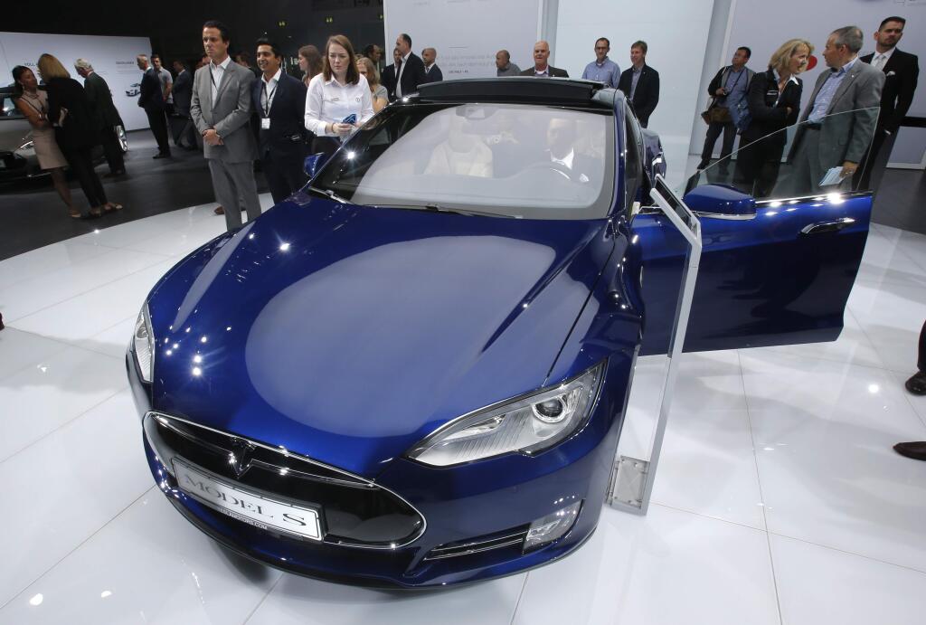 FILE - In this Sept. 15, 2015 file photo, a Tesla Model S is on display on the first press day of the Frankfurt Auto Show IAA in Frankfurt, Germany. (AP Photo/Michael Probst, File)