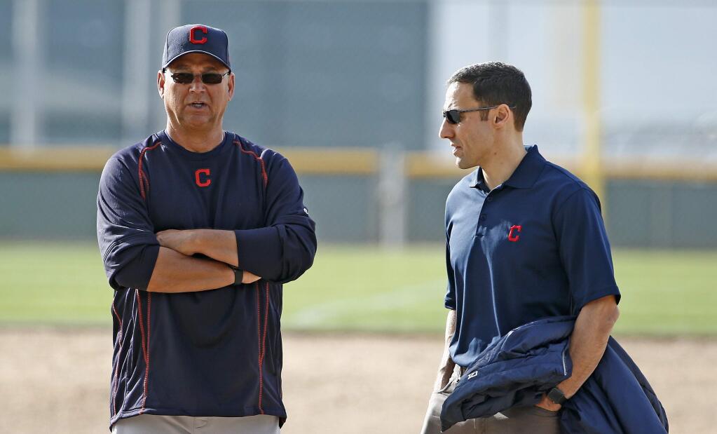 Cleveland Indians manager Terry Francona, left, talks with Chris Antonetti, right, president of baseball operations, at the team's spring training facility Tuesday, Feb. 14, 2017, in Goodyear, Ariz. (AP Photo/Ross D. Franklin)