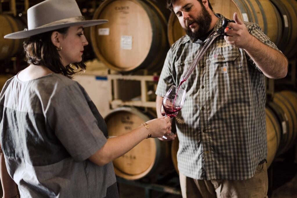 Winemaker Charlie Fauroat is pictured with Alexia Pellegrini, fourth-generation vintner and general manager. (Olivet Lane Vineyard)