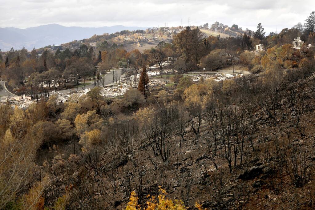 Burned vegetation covers the hillsides around the remnants of homes destroyed in the Tubbs fire in the Fountaingrove area of Santa Rosa. Photo taken on Sunday, November 12, 2017. (BETH SCHLANKER/ The Press Democrat)