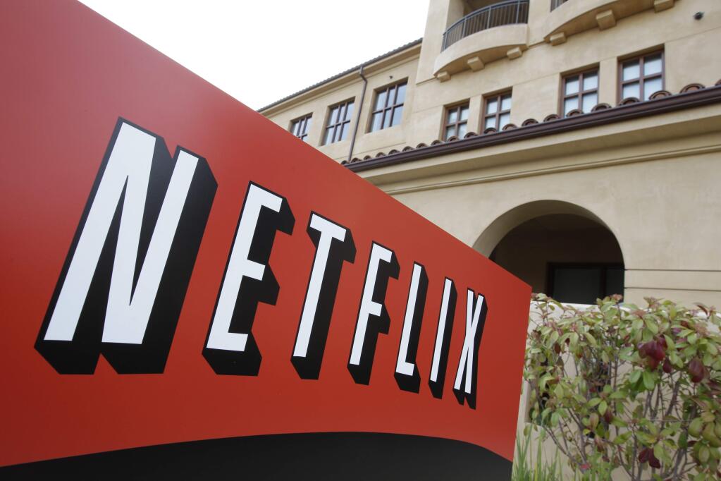 FILE - This March 20, 2012 file photo shows Netfilx headquarters in Los Gatos, Calif. Netflix on Thursday, Oct. 8, 2015 announced it is raising the price of its Internet video service by $1 in the U.S. and several other countries to help cover its escalating costs for shows such as 'House of Cards' and other original programming. (AP Photo/Paul Sakuma, File)