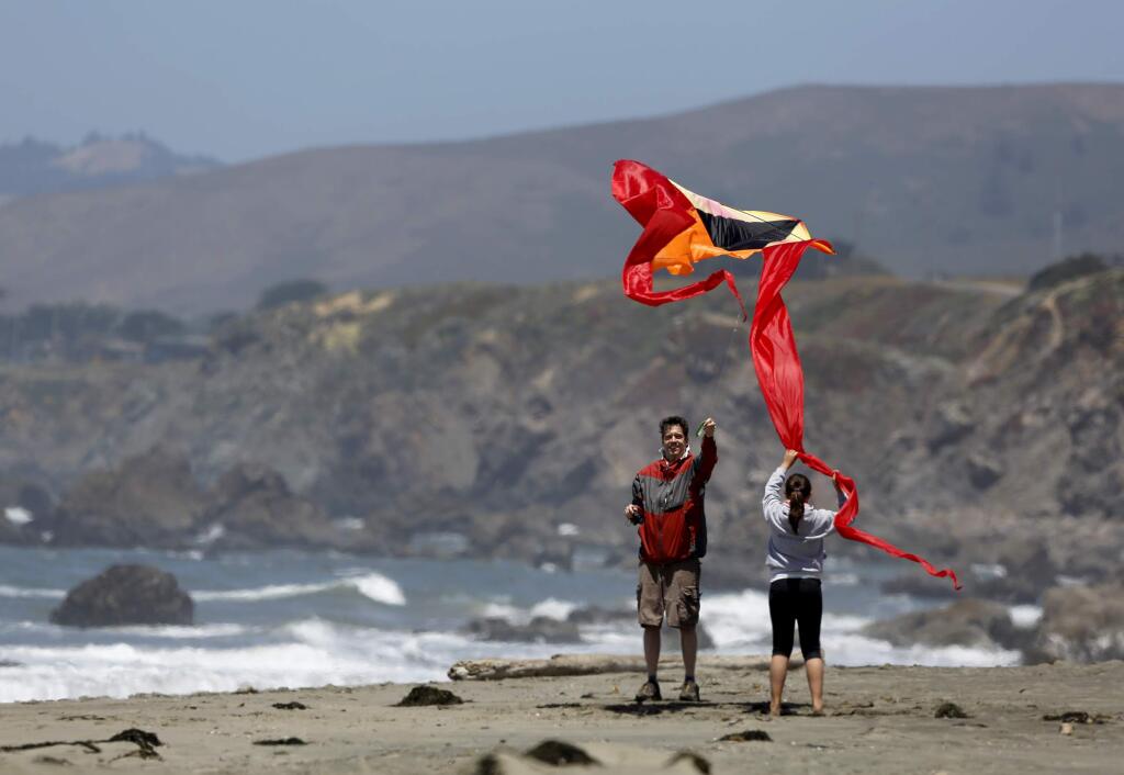 Steffen Layer and his daughter Layna, 12, of Santa Rosa fly a kite at North Salmon Creek beach near Bodega Bay, on Tuesday, June 17, 2014. (BETH SCHLANKER/ The Press Democrat)