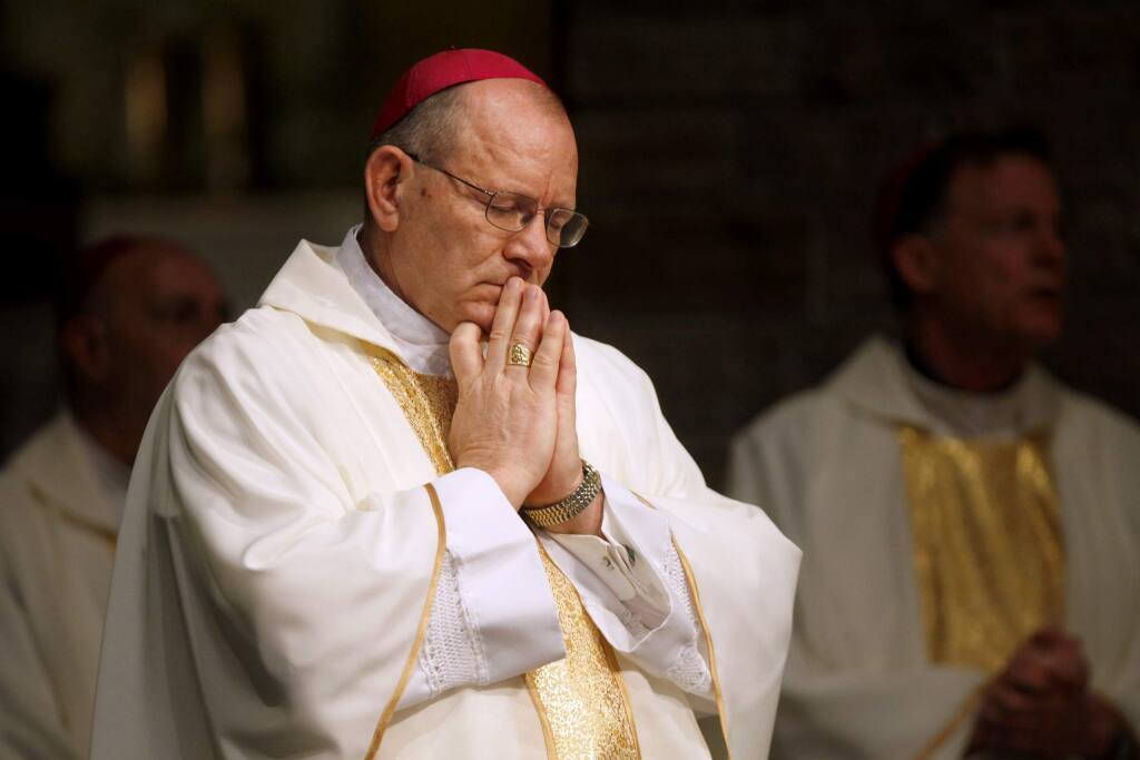 Rev. Robert Vasa, the new Coadjuctor Bishop of Santa Rosa, closes his eyes in prayer during a mass for his reception at St. Eugene's Cathedral in Santa Rosa, California on Sunday, March 6, 2011. (BETH SCHLANKER/ The Press Democrat)