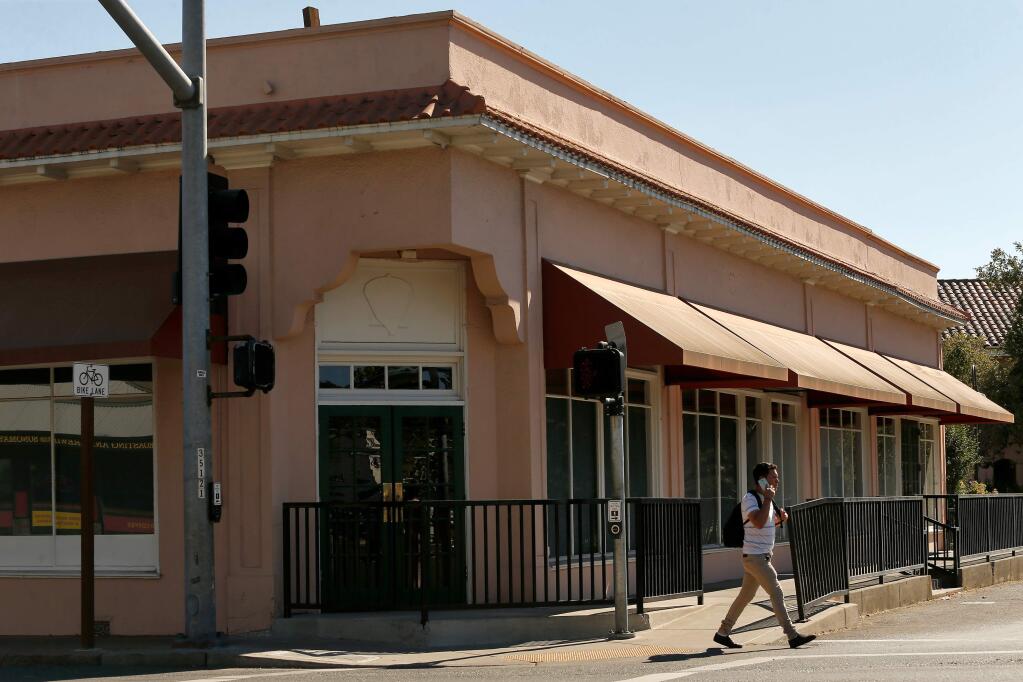 A pedestrian walks past the vacant building that was once Big 3 Diner, at the corner of Boyes Boulevard and Highway 12, in Boyes Hot Springs, California on Saturday, July 8, 2017. (Alvin Jornada / The Press Democrat)