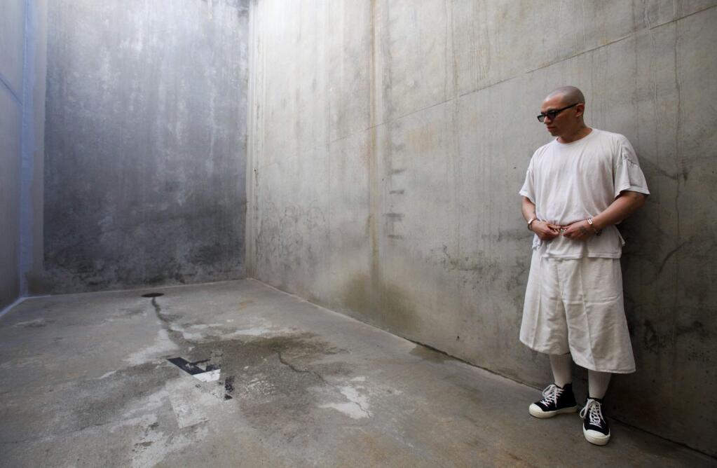 Inmate Javier Zubiate stands in the concrete recreation area in one of the Secure Housing Units at Pelican Bay State Prison in Crescent City. (MARK BOSTER / Los Angeles Times, 2012)