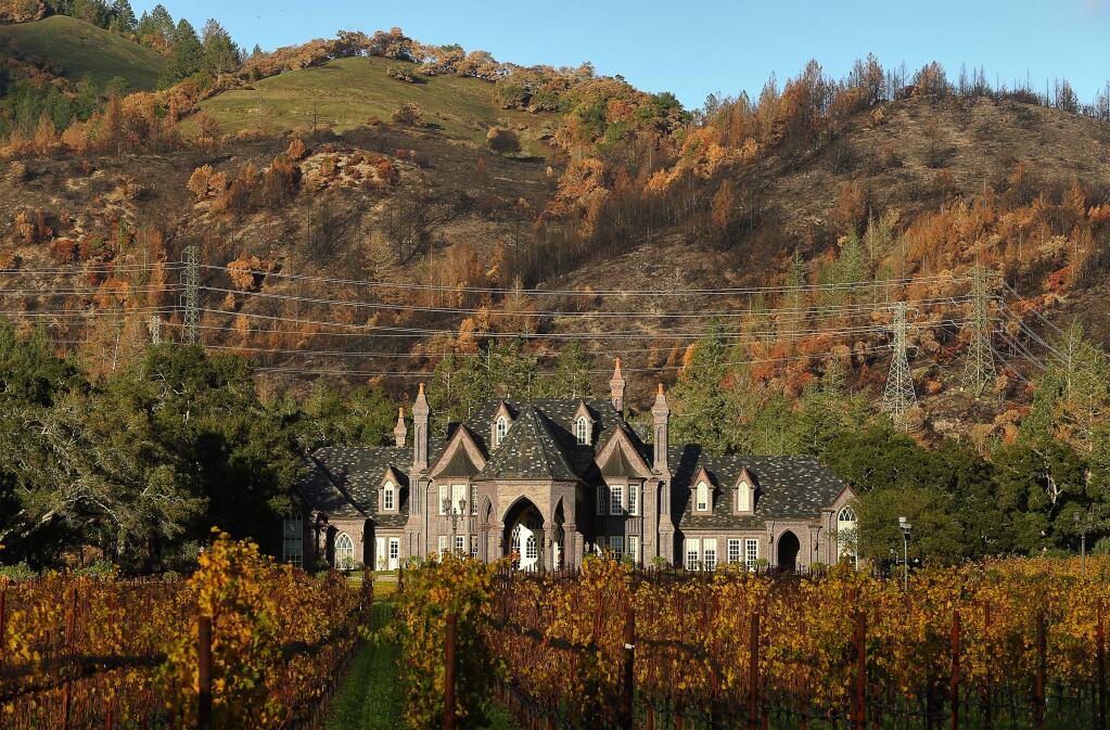 The charred hillsides provide a stark backdrop at the Ledson Winery & Vineyards, along Highway 12.(Christopher Chung/ The Press Democrat)