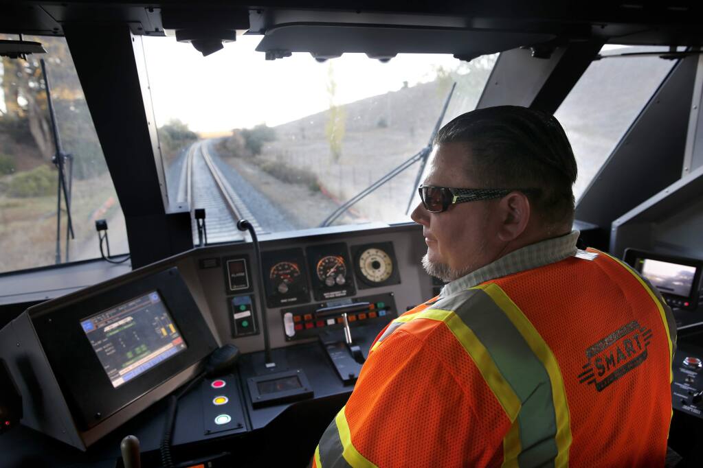 Controller supervisor Matt Shiffrar drives the SMART train along a section during speed testing through 'The Narrows' in Novato, on Tuesday, November 3, 2015. (BETH SCHLANKER/ The Press Democrat)