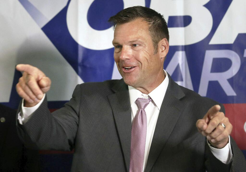 FILE - In this Aug. 8, 2018, file photo, Secretary of State Kris Kobach speaks to the media during a news conference at the Topeka Capitol Plaza hotel in Topeka, Kan. Kansas Gov. Jeff Colyer conceded late Tuesday, Aug. 14, 2018, in the state's Republican gubernatorial primary, saying he will endorse Kobach a week after their neck-and-neck finish threatened to send the race to a recount. (Thad Allton/The Topeka Capital-Journal via AP, File)