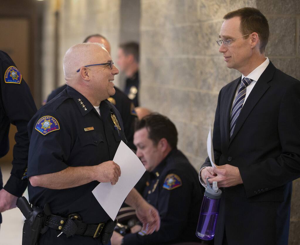 In this file photo, Rohnert Park Department of Public Safety Director Tim Mattos greets City Manager Darrin Jenkins before an “All Hands” meeting with his department personnel in June 2020. (photo by John Burgess/The Press Democrat)
