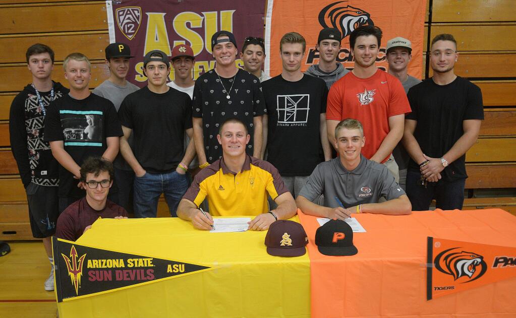 SUMNER FOWLER/FOR THE ARGUS=COURIERCasa Grande High infielders Spencer Torkelson and Hance Smith, surrounded by teammates and friends, some from Petaluma High, sign letters of intent to play Division 1 baseball, Torkelson at Arizona State University and Smith at the University of the Pacific.