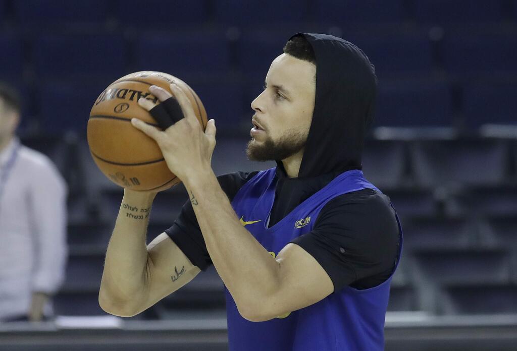 The Golden State Warriors guard Stephen Curry shoots during a team practice in Oakland, Wednesday, June 12, 2019. The Warriors are scheduled to play the Toronto Raptors in Game 6 of the NBA Finals on Thursday. (AP Photo/Jeff Chiu)