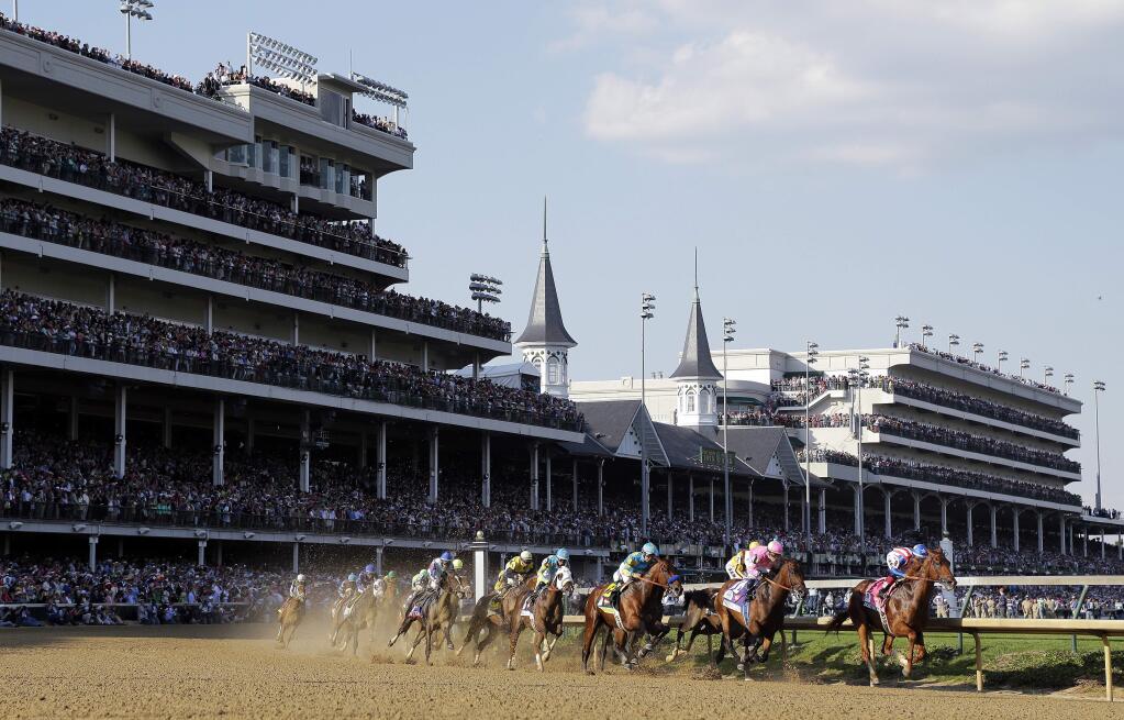 Horses make their way around turn one during the 141st running of the Kentucky Derby horse race at Churchill Downs Saturday, May 2, 2015, in Louisville, Ky. (AP Photo/Darron Cummings)