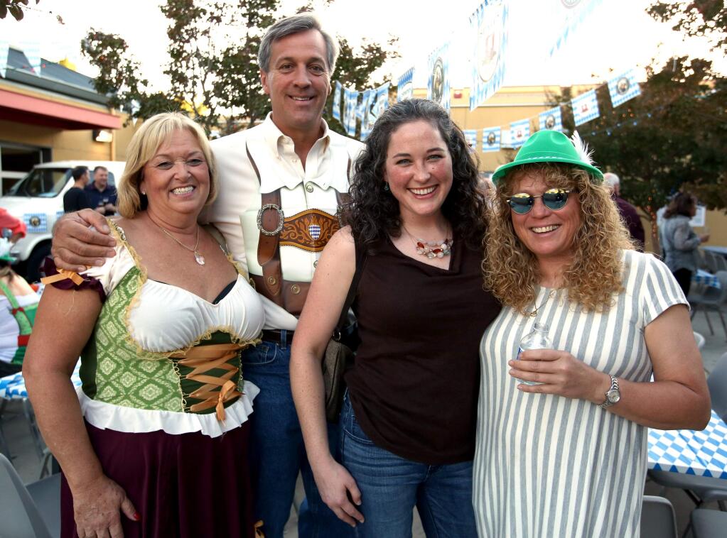 Viola Pedersen, from left, Allan Beer, Courtney Quinn and Wendy Quinn at the Cowbells and Lederhosen: A Bavarian Oktoberfest event held at Cardinal Newman High School in support of the Sonoma County Special Olympics, Saturday, October 4, 2014.(Crista Jeremiason / The Press Democrat)