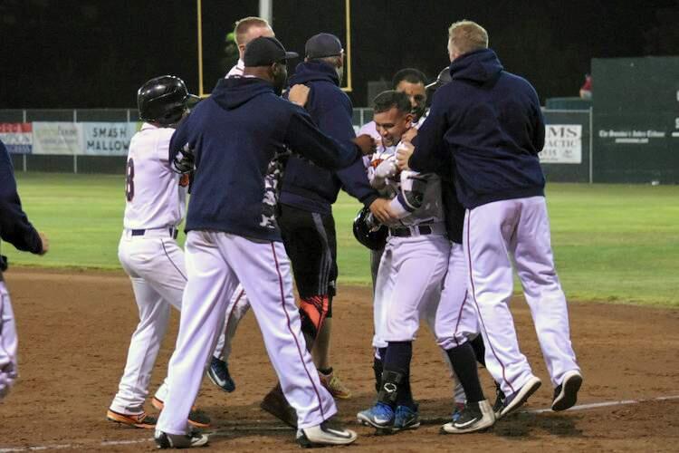 Eddie Mora-Loera celebrates with his teammates after the Sonoma Stompers' walk-off win in their game against the San Rafael Pacifics, July 31, 2018 in Sonoma, Calif. (James W. Toy III / Sonoma Stompers)