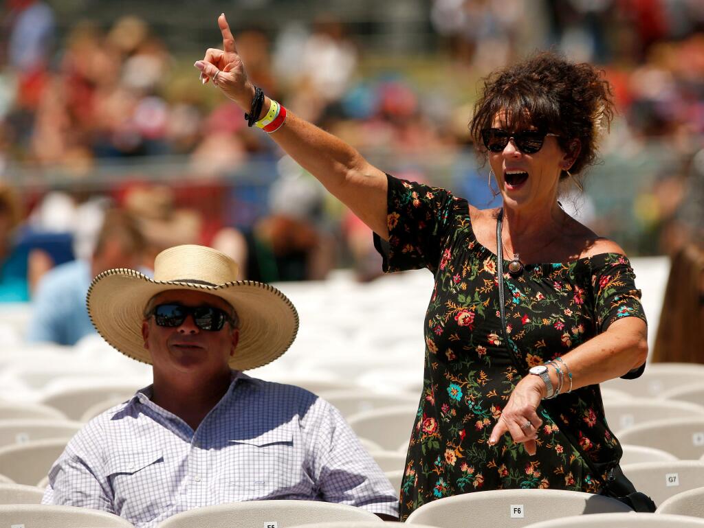 Renee and Earl Lupton of Colton enjoy music performed by country music recording artist Ned LeDoux on stage during Country Summer at the Sonoma County Fairgrounds in Santa Rosa, California on Friday, June 16, 2017. (Alvin Jornada / The Press Democrat)