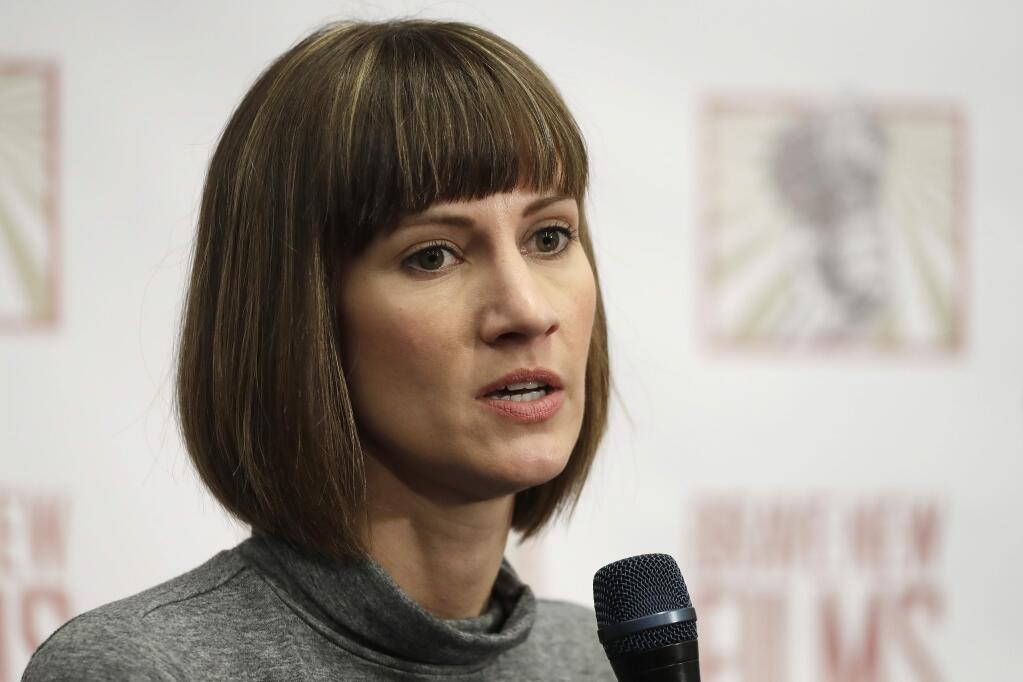 Rachel Crooks speaks at a news conference, Monday, Dec. 11, 2017, in New York to discuss her accusations of sexual misconduct against Donald Trump. The women, who first shared their stories before the November 2016 election, called for a congressional investigation into Trump's alleged behavior. (AP Photo/Mark Lennihan)