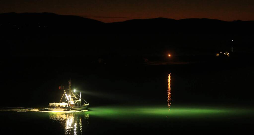 Skipped by Tony Anello, the Annabelle heads out in smooth bay waters to place crab pots during the opening of the season, Friday Dec, 2, 2016 in Bodega Bay. (Kent Porter / The Press Democrat) 2016