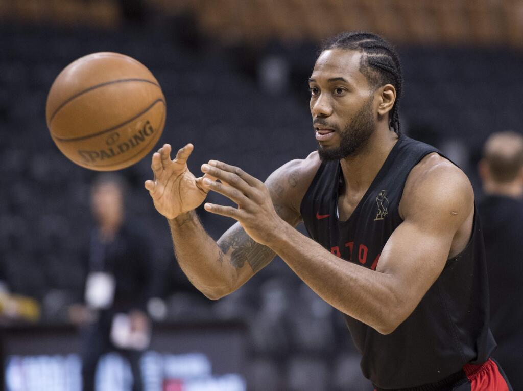 The Toronto Raptors' Kawhi Leonard passes during practice for the NBA Finals in Toronto on Wednesday, May 29, 2019. Game 1 of the NBA Finals between the Raptors and Golden State Warriors is Thursday in Toronto. (Frank Gunn/The Canadian Press via AP)
