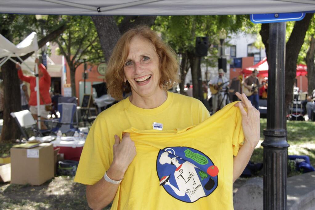 Elly Lichenstein, Artistic Director of the Cinnabar Theater selling tickets and shirts during the Taste of Petaluma, which benefits the Cinnabar Theater, on Saturday, August 22, 2015. (Jim Johnson/For the Argus-Courier)