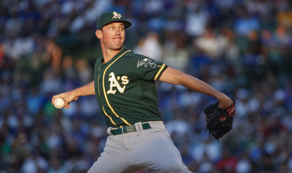 Oakland Athletics starting pitcher Chris Bassitt delivers against the Chicago Cubs during the first inning of a baseball game, Monday, Aug. 5, 2019, in Chicago. (AP Photo/Kamil Krzaczynski)