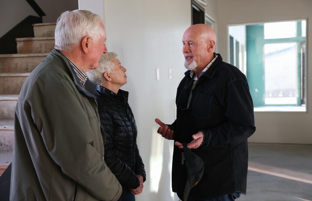 Bill Gallaher, right, shown in a 2023 file photo, talks with his wife, Cindy, and Santa Rosa attorney Doug Bosco during a check presentation event at the Roseland Boys & Girls Club in Santa Rosa, Friday, Jan. 20, 2023. (Christopher Chung / The Press Democrat file)