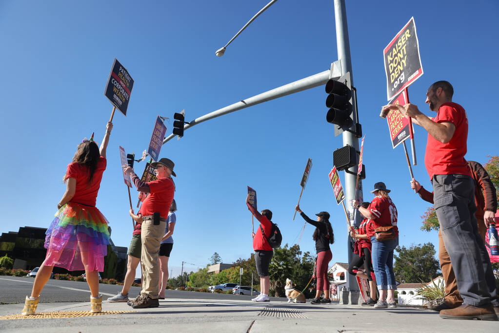 Mental health workers with the National Union of Health Care Workers picket Friday, Sept. 2, 2022, in front of the Kaiser Permanente facility on the corner of Bicentennial Way and Mendocino Avenue in Santa Rosa. (Christopher Chung/The Press Democrat)