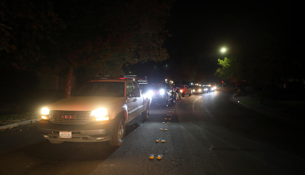 Residents line San Ramon Way as they evacuate their homes in Santa Rosa on Sunday, Sept. 27, 2020. (Christopher Chung / The Press Democrat)