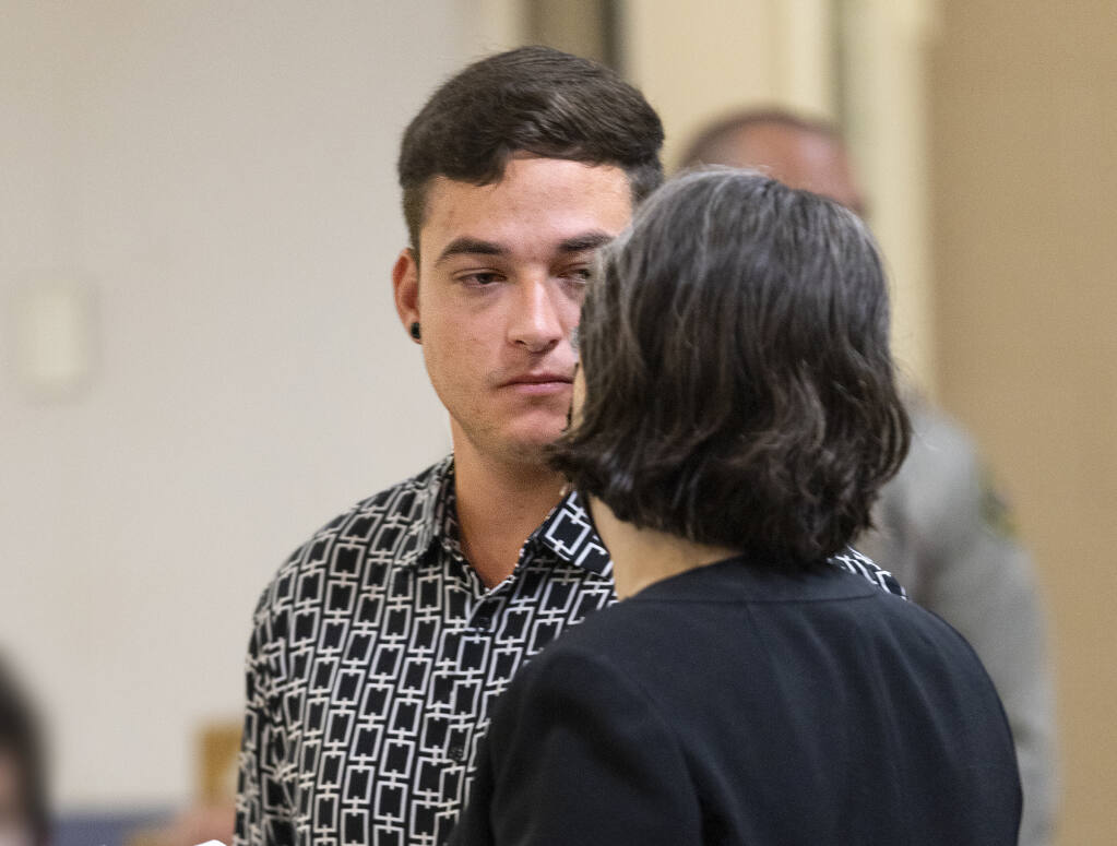 Evan Frostick talks to his public defender after he was charged with murder and child cruelty in the death of his 15-month-old daughter Charlotte, who died from fentanyl exposure on May 9. A warrant was issued on the same charges for Madison Bernard, the mother of Charlotte, who failed to appear in Sonoma County Superior Court in Santa Rosa on Thursday, Aug. 4, 2022. (John Burgess / The Press Democrat)