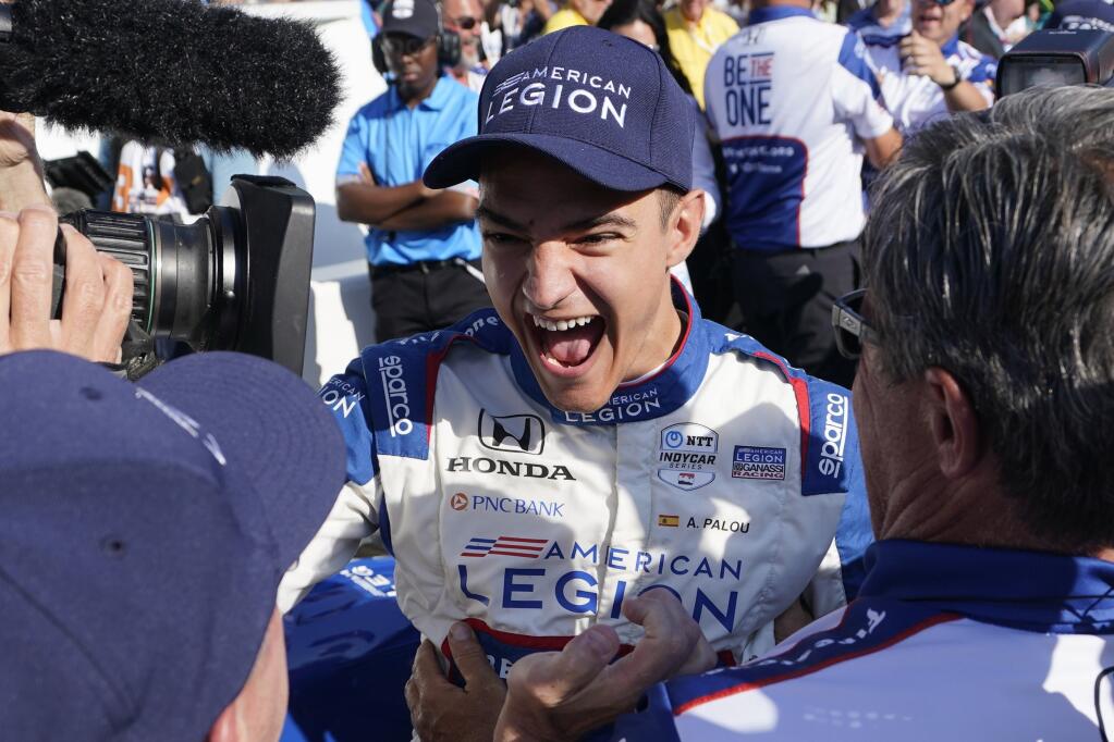 Alex Palou, of Spain, celebrates winning the pole for the Indianapolis 500 auto race at Indianapolis Motor Speedway, Sunday, May 21, 2023, in Indianapolis. (AP Photo/Darron Cummings)