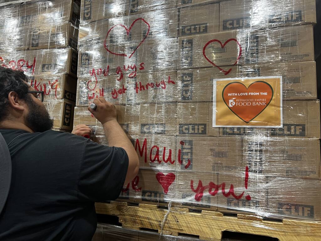 Redwood Empire Food Bank is donating 16 pallets of Clif Bars to Maui residents amid wildfires. Team members signed their well wishes on the outside of the packaged Clif Bars. (Photo courtesy of Redwood Empire Food Bank)