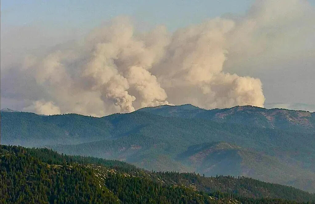 Three smoke plumes from the McKinney Fire are seen early Saturday, July 30, 2022, from a California Department of Forestry and Fire Protection, Cal Fire, outdoor camera called Antelope Mt./Yreka. (California Department of Forestry and Fire Protection/Cal Fire via AP)