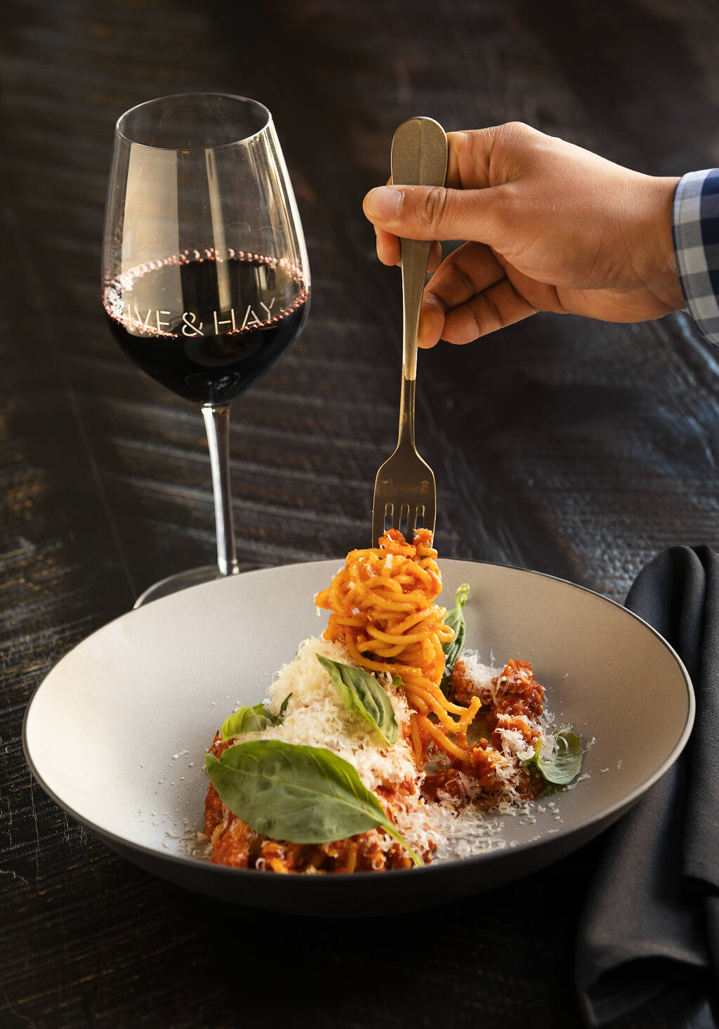 Spaghetti with house made calabrese sausage,tomato conserva and mozzarella from Olive & Hay in the Meritage Resort and Spa in Napa. (John Burgess/The Press Democrat)
